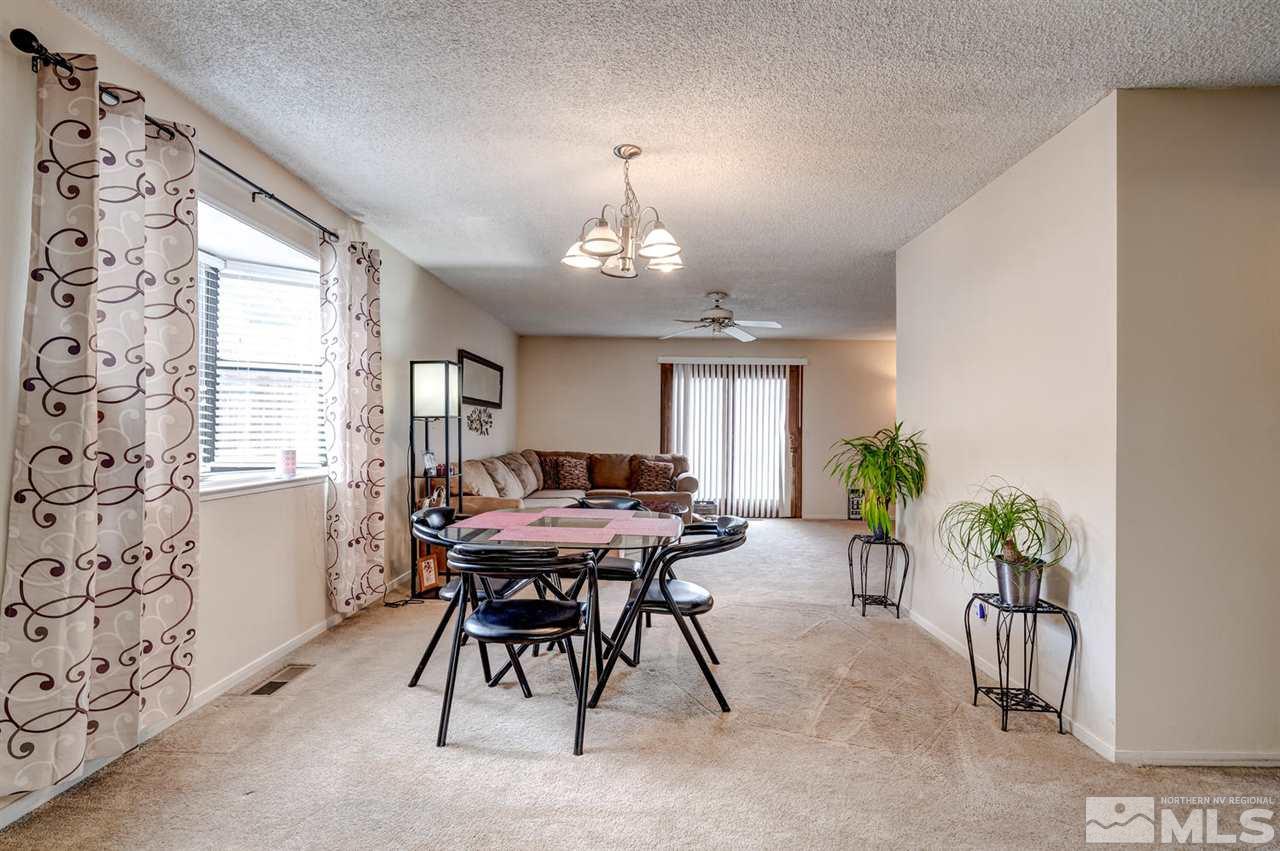3315 Bowie Road Reno, NV 89503 - Photo 9 of 35 a view of a dining room with furniture window and wooden floor