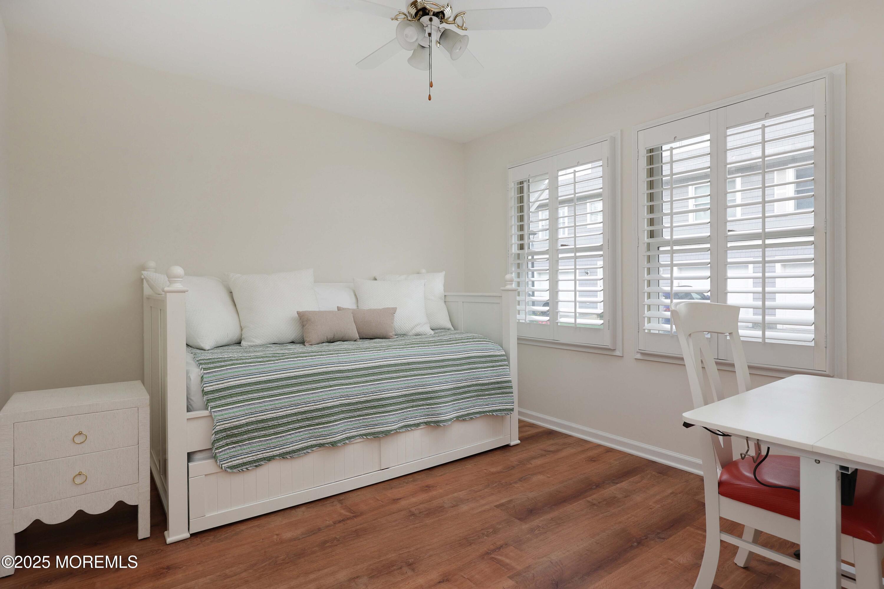 200 2nd Avenue, Unit 14 Belmar, NJ 07719 - Photo 11 of 32 a view of a room with a window and wooden floor