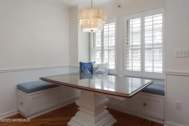 a kitchen with stainless steel appliances granite countertop a refrigerator a stove a sink a center island and a refrigerator