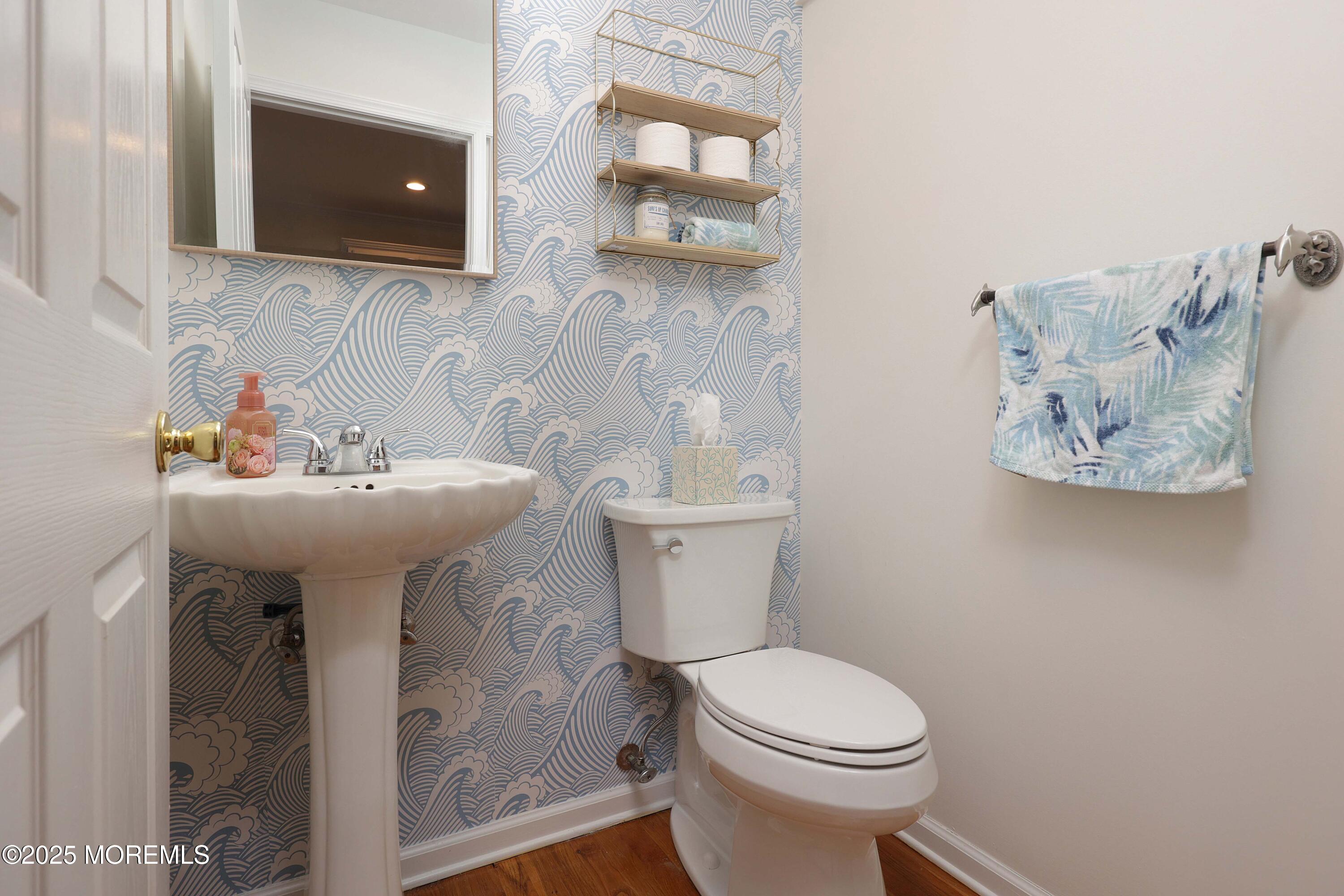 200 2nd Avenue, Unit 14 Belmar, NJ 07719 - Photo 22 of 32 a bathroom with a sink toilet and mirror