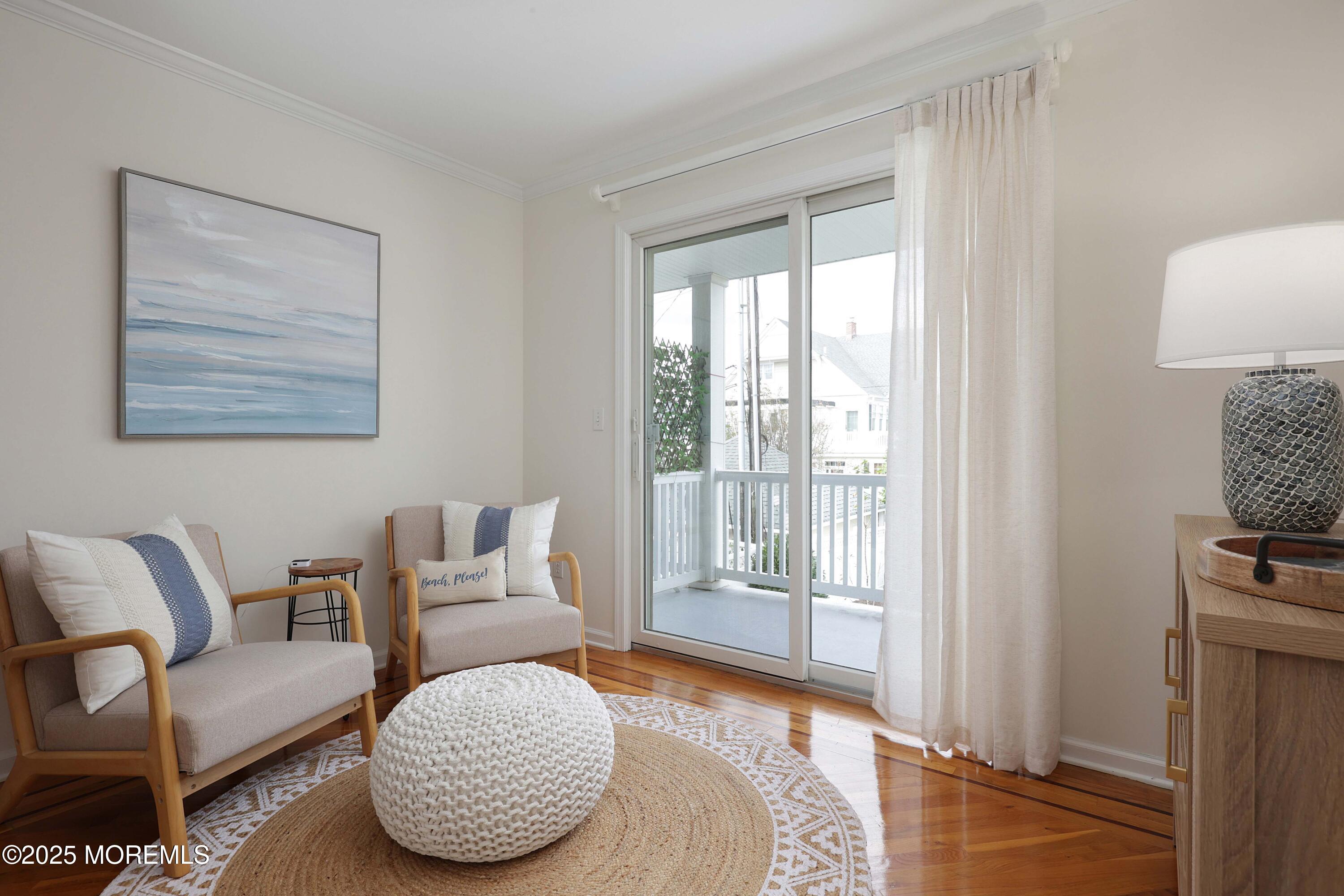200 2nd Avenue, Unit 14 Belmar, NJ 07719 - Photo 24 of 32 a living room with furniture and a window