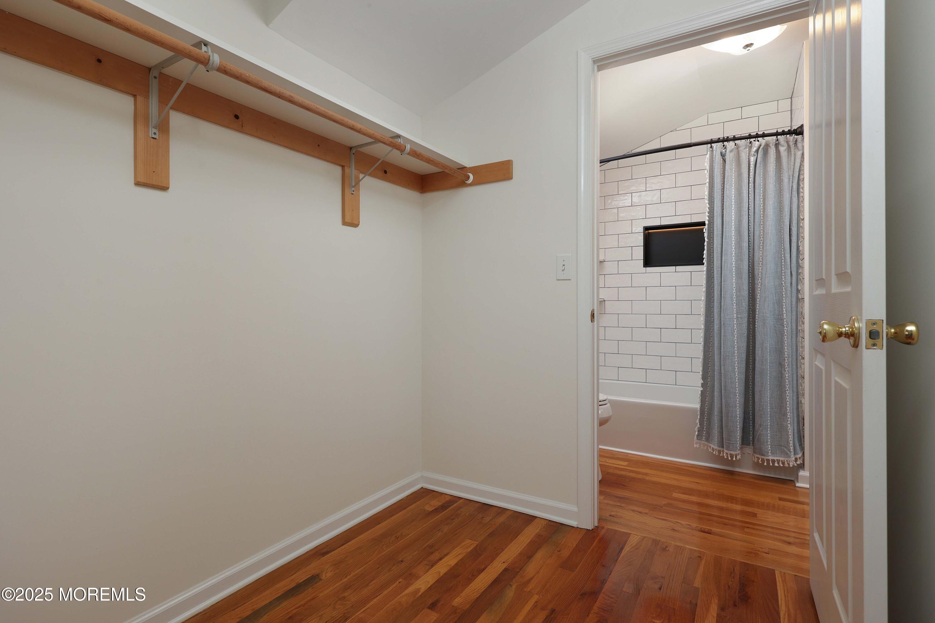 200 2nd Avenue, Unit 14 Belmar, NJ 07719 - Photo 29 of 32 a view of a hallway with wooden floor and closet