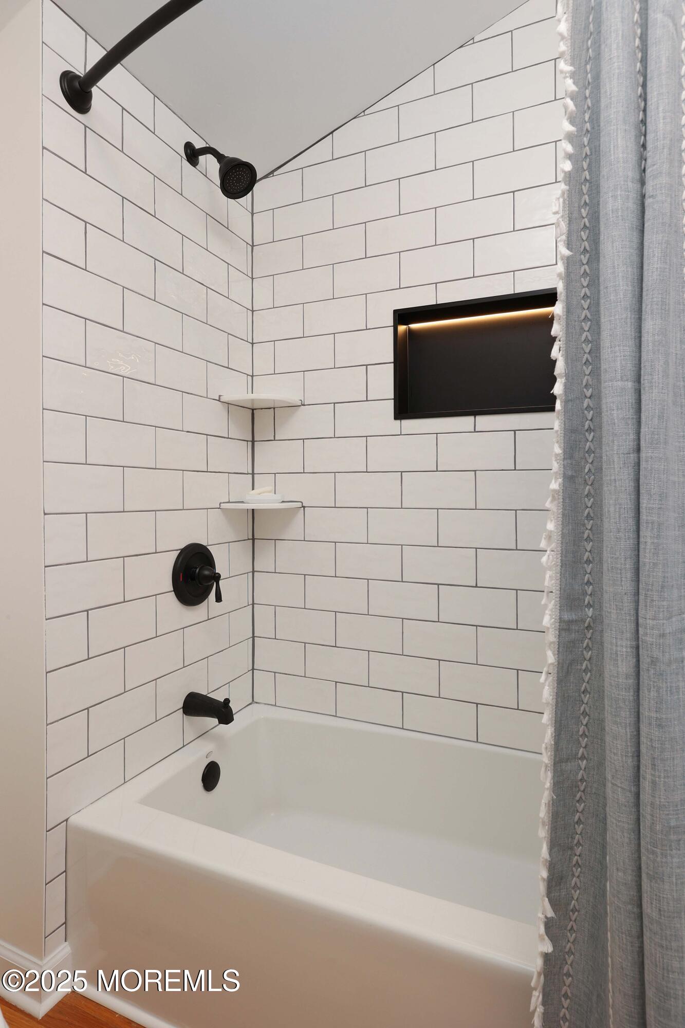 200 2nd Avenue, Unit 14 Belmar, NJ 07719 - Photo 31 of 32 a bathroom with a sink and a shower