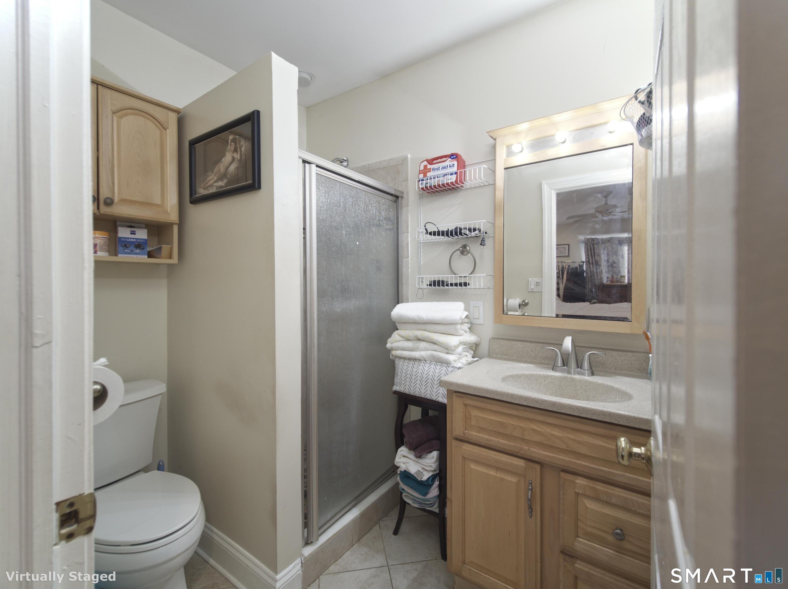 21 Mathew Street Milford, CT 06460 - Photo 17 of 28 a bathroom with a granite countertop sink toilet and shower