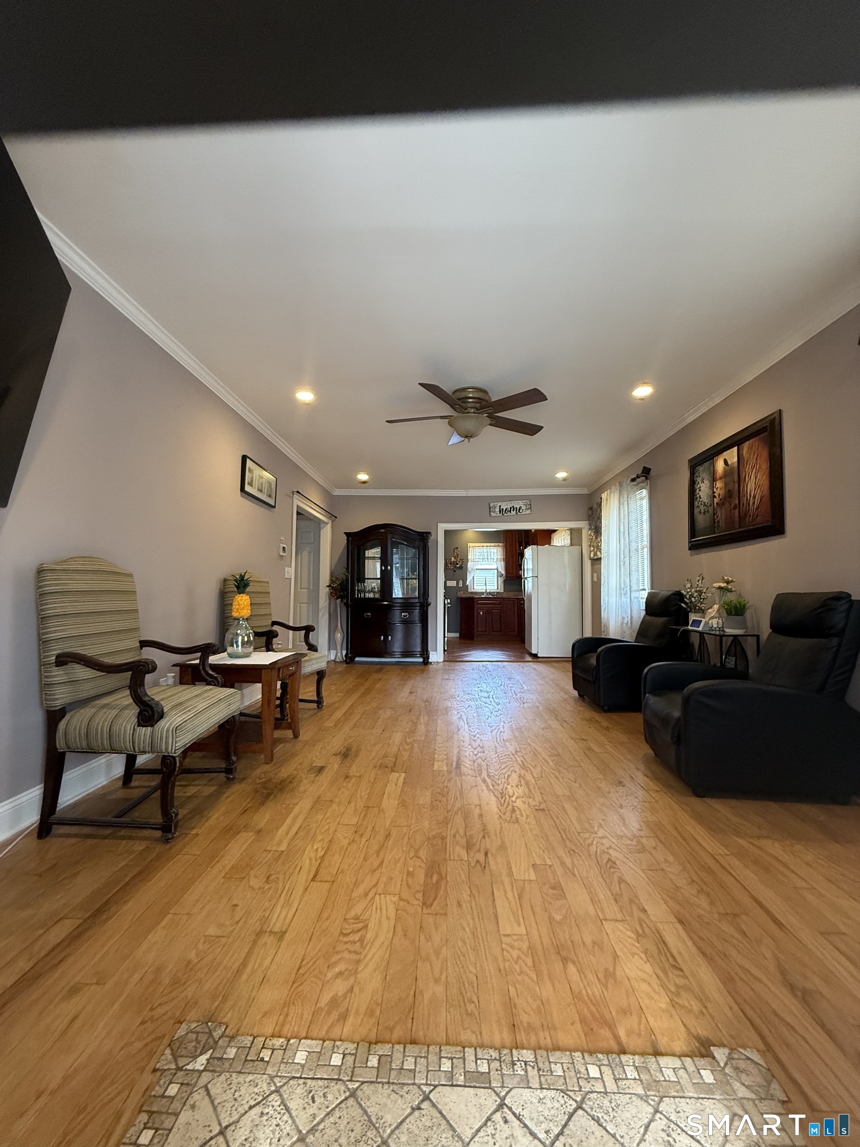 21 Mathew Street Milford, CT 06460 - Photo 8 of 28 a living room with furniture and a flat screen tv
