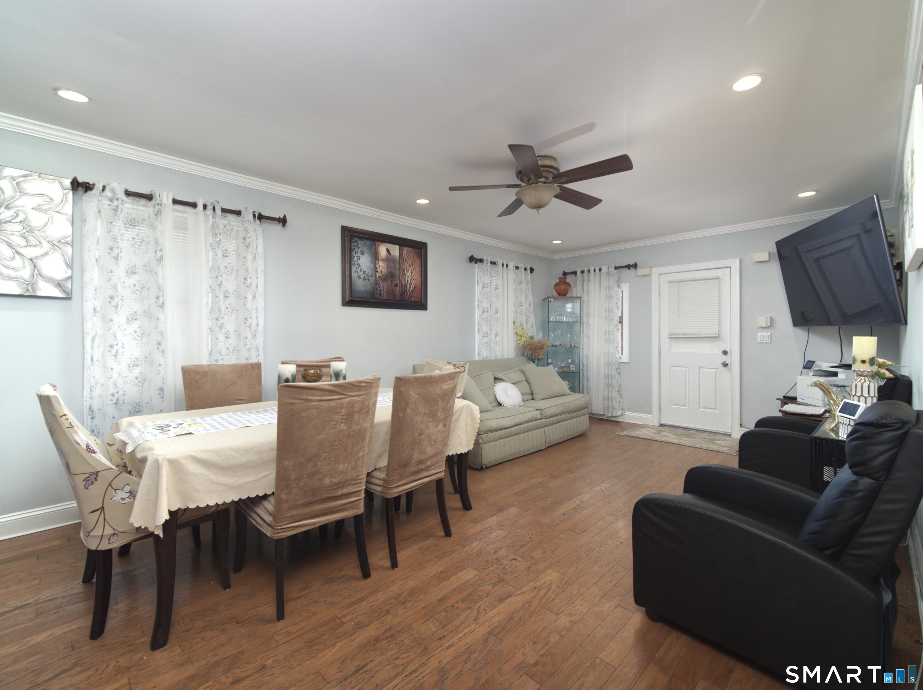 21 Mathew Street Milford, CT 06460 - Photo 9 of 28 a living room with furniture a ceiling fan and a rug