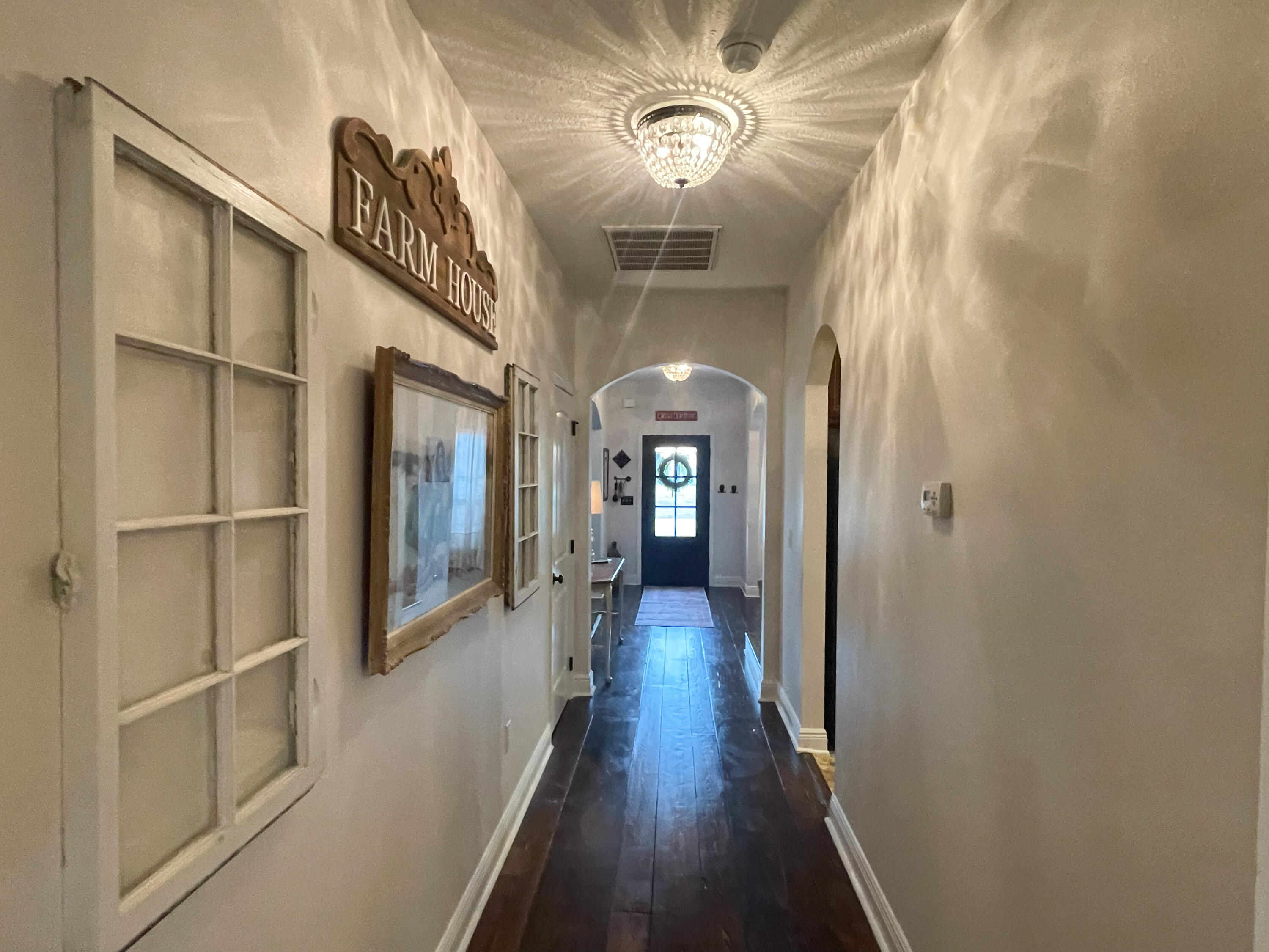 3362 Citrine Circle Crestview, FL 32539 - Photo 11 of 24 a view of a hallway with wooden floor