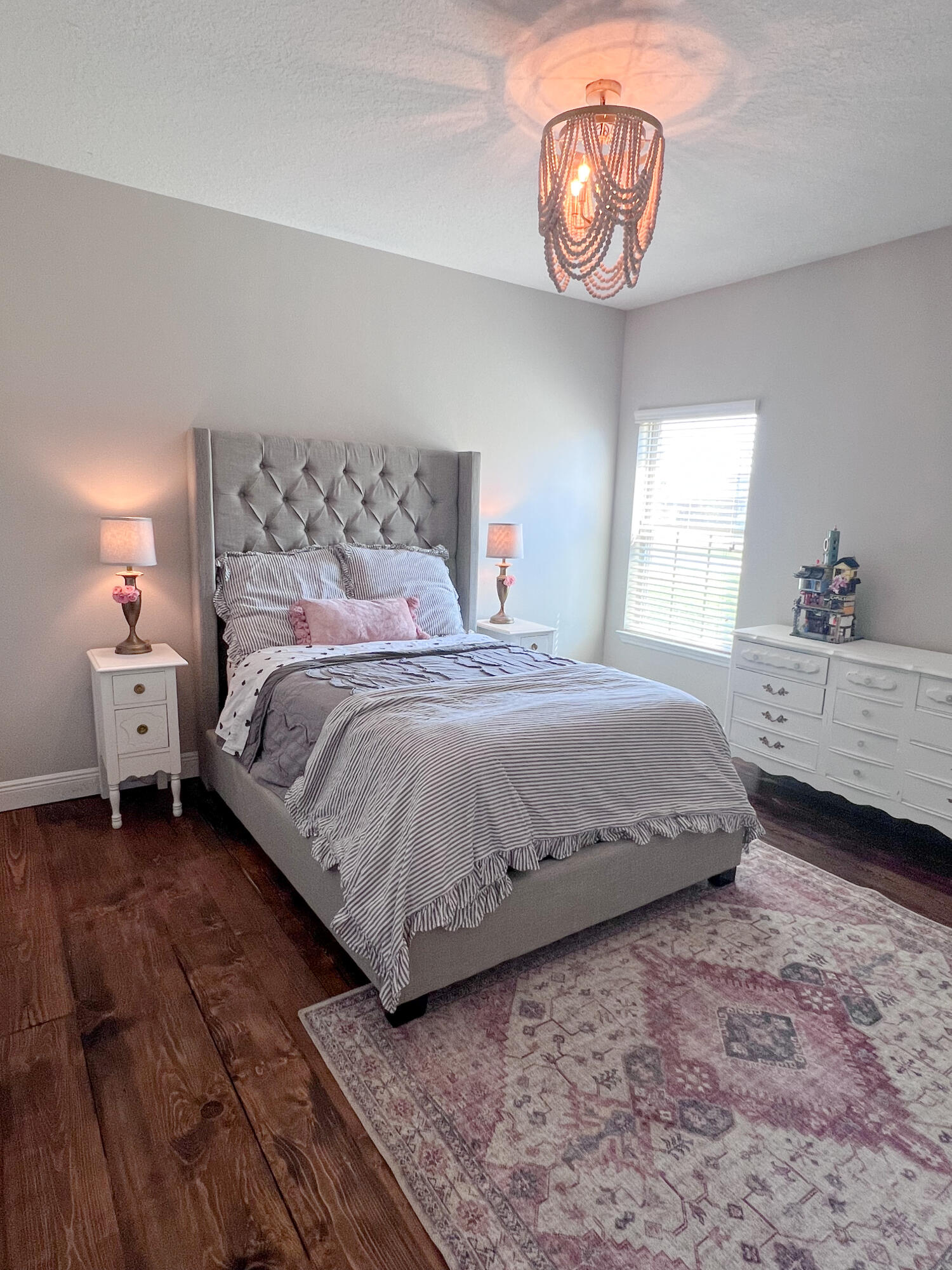 3362 Citrine Circle Crestview, FL 32539 - Photo 17 of 24 a bedroom with a bed and a chandelier