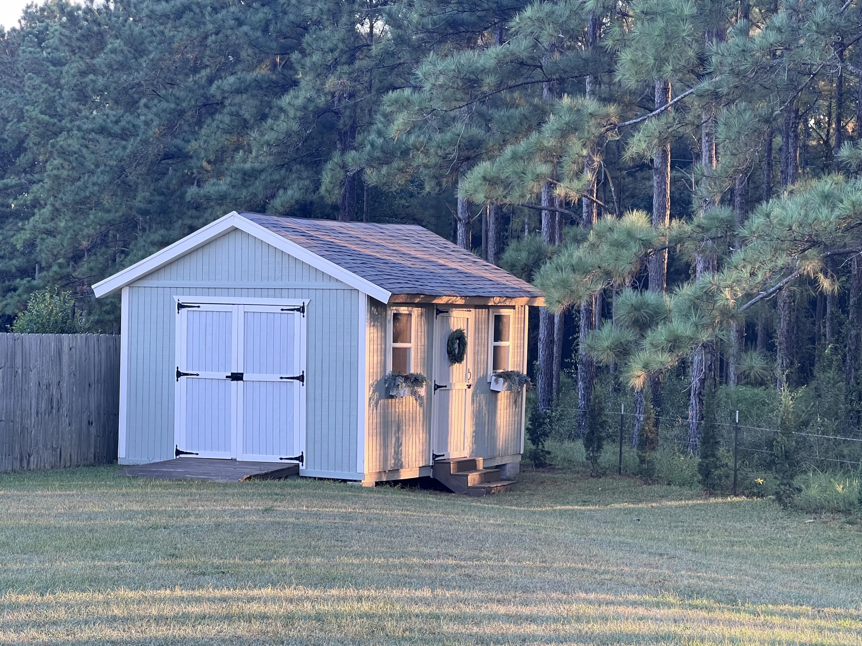 3362 Citrine Circle Crestview, FL 32539 - Photo 24 of 24 a view of a house with a yard and tree