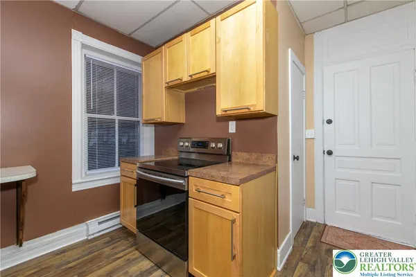 a kitchen that has a stove and a window