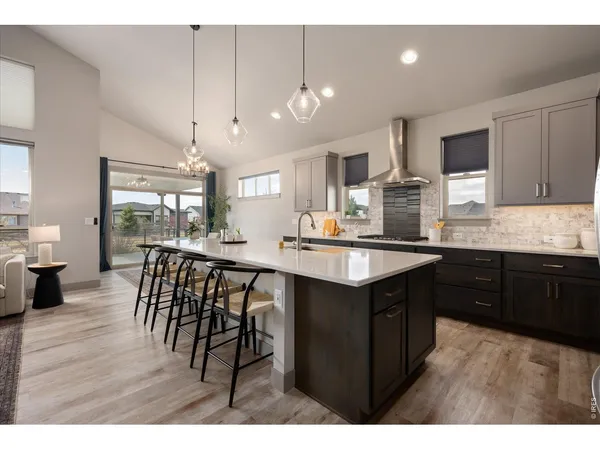 a kitchen with cabinets and stainless steel appliances