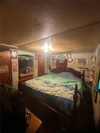a bedroom with a bed and a mirror