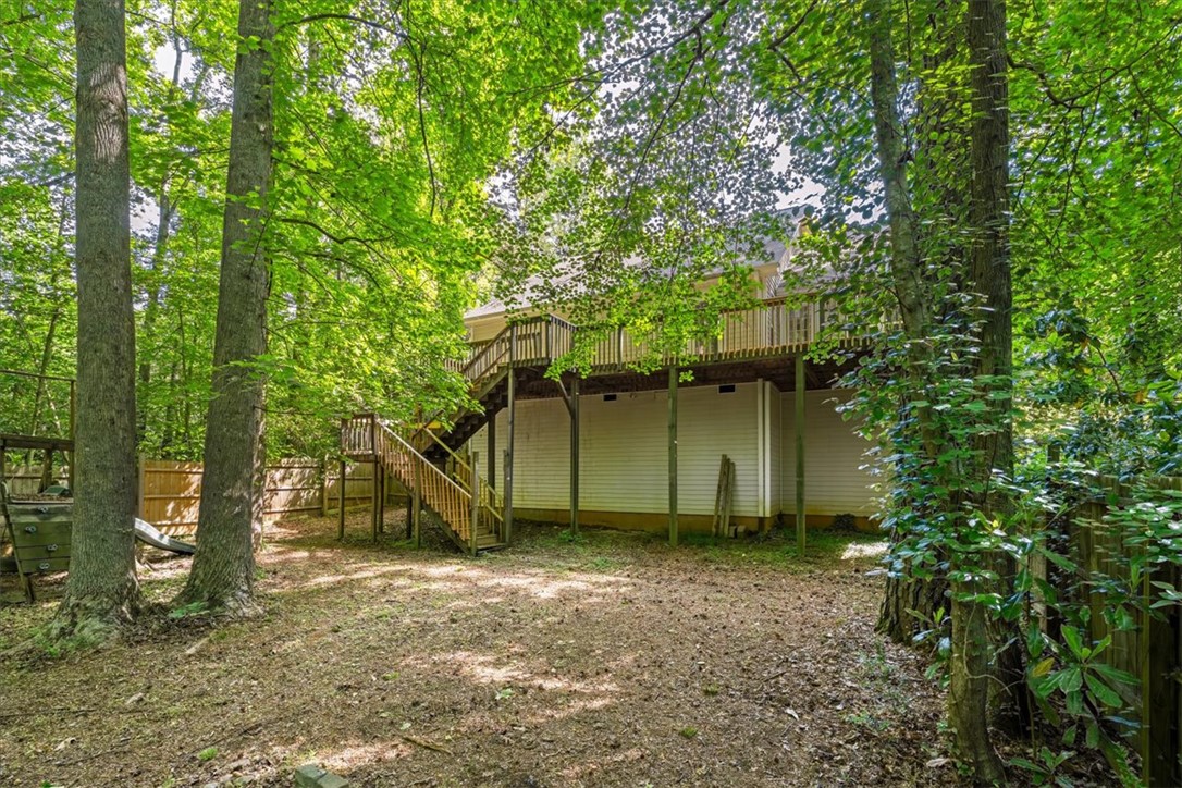 210 Briarcliff Road Central, SC 29630 - Photo 35 of 39 This private yard features a spacious deck, perfect for outdoor living amidst lush greenery.