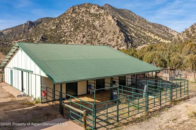 a view of a house with a yard and garage