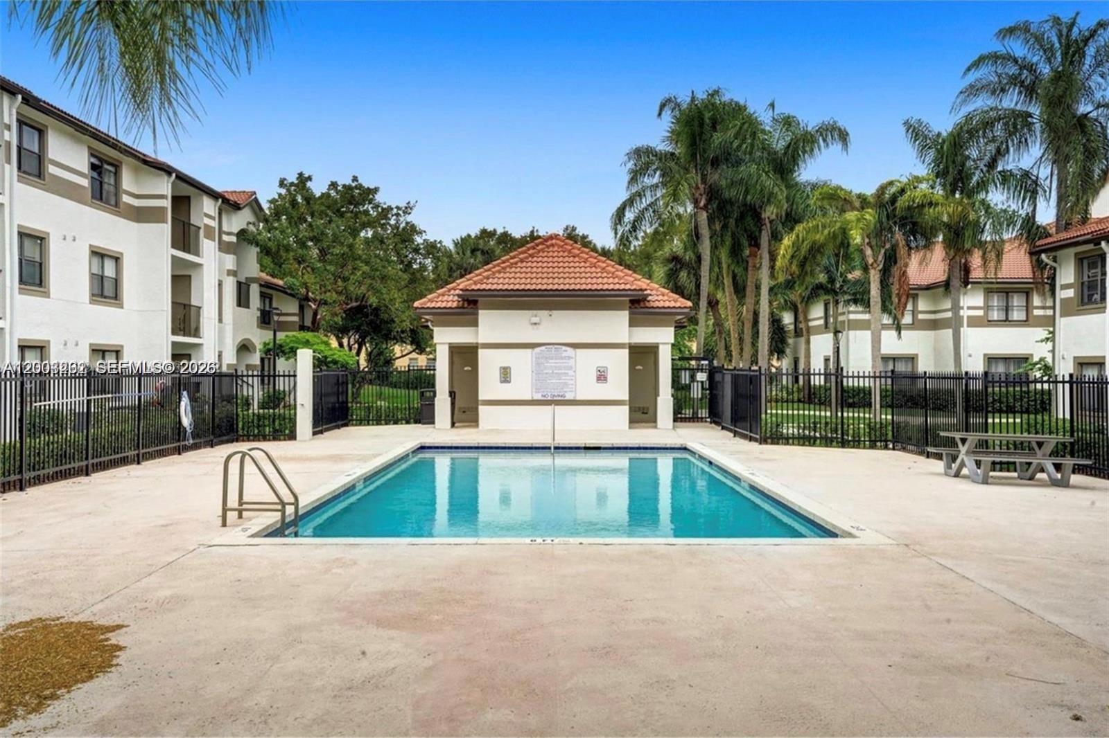 620 South Park Road, Unit 312 Hollywood, FL 33021 - Photo 8 of 14 a view of swimming pool with palm trees