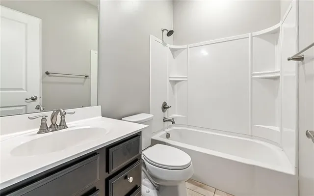 a bathroom with a sink a toilet and a bathtub