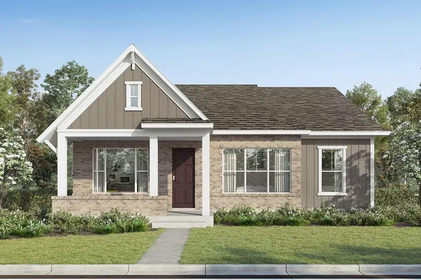 front view of a house with a yard