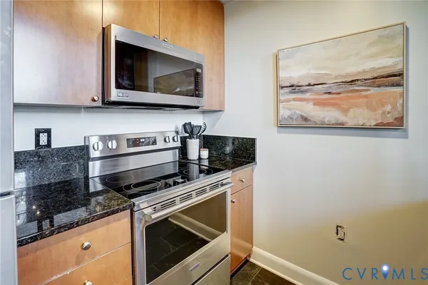 a kitchen with a stove and microwave