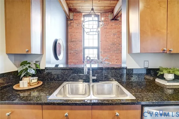 a kitchen with sink and window