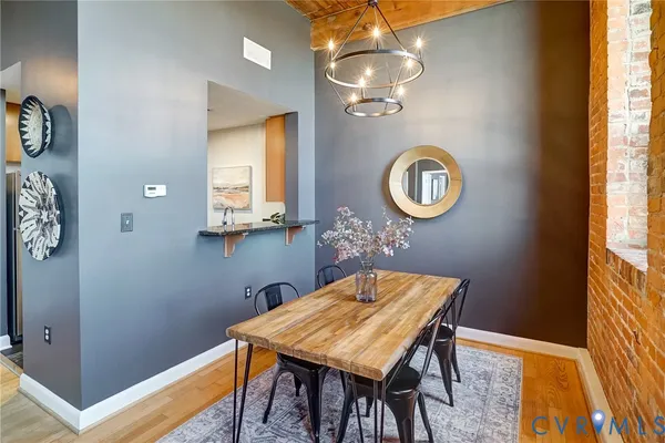 a view of a dining room with furniture and chandelier