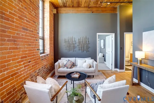 a living room with furniture and a rug