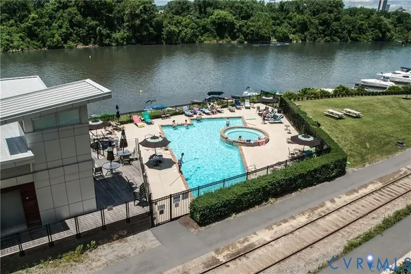 an aerial view of a house with swimming pool and outdoor space
