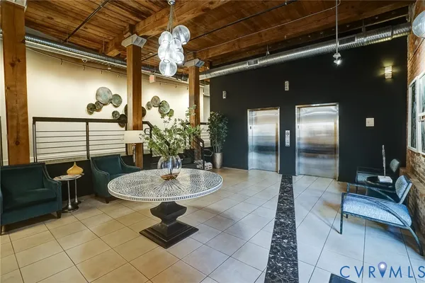 a lobby with furniture and window