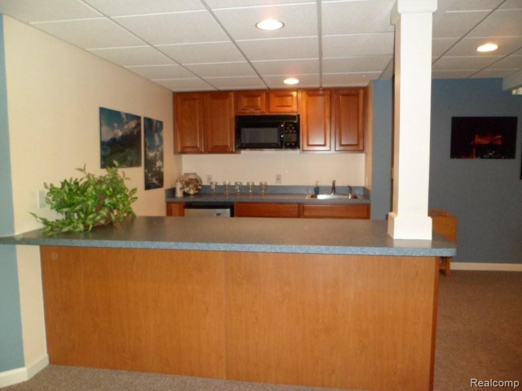 11102 Pinehurst Road, Unit 27 Plymouth, MI 48170 - Photo 25 of 25 Lower Level Kitchenette