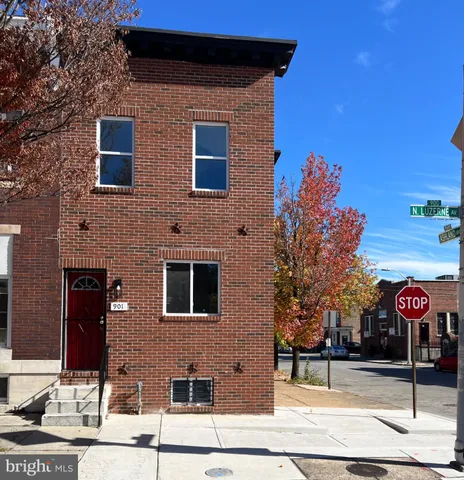 a view of a brick house with a street