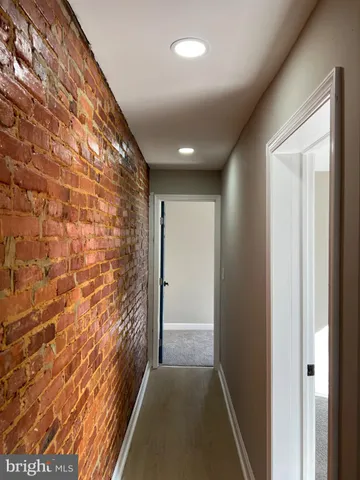 a view of hallway with a large window