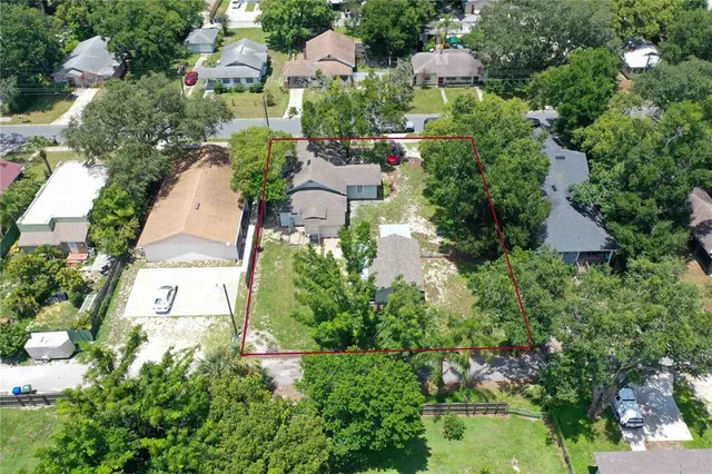 an aerial view of multiple houses with yard