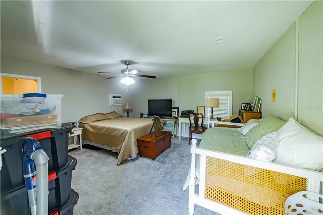 a bedroom with bed and a couch