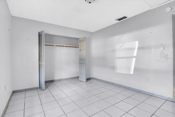 a view of an empty room and window