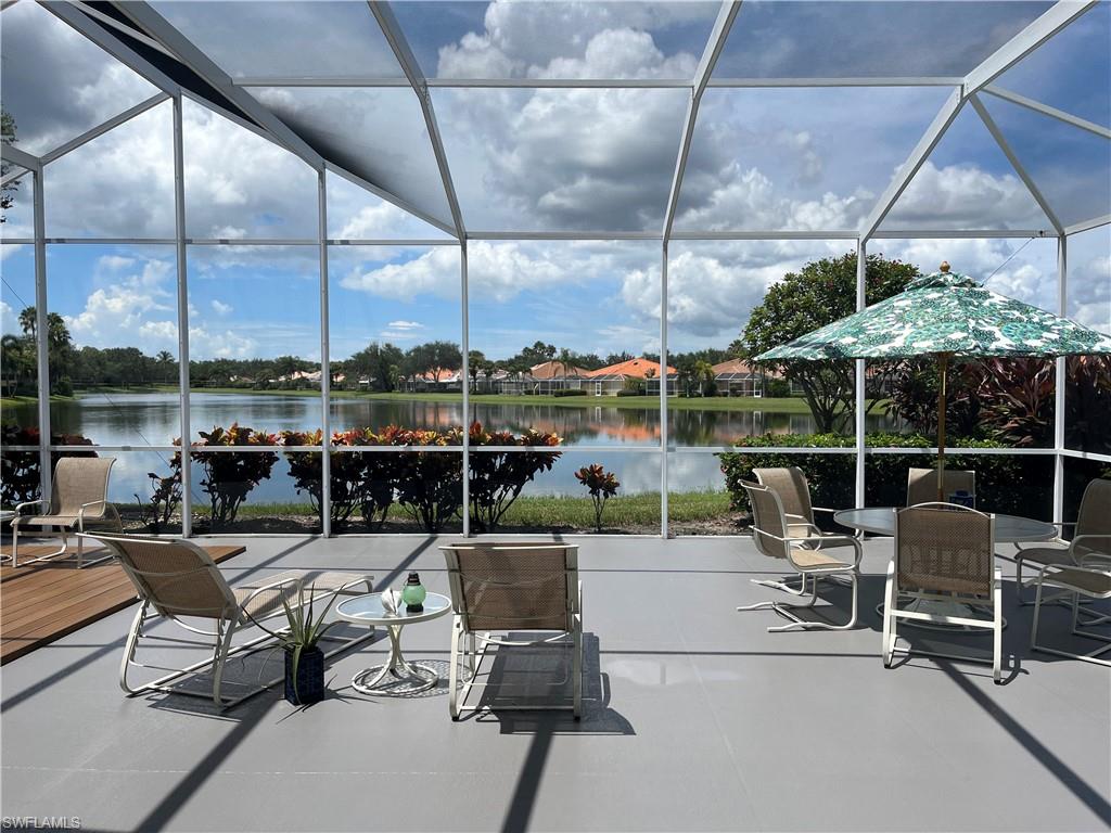 5477 Freeport Lane Naples, FL 34119 - Photo 27 of 36 a living room with patio furniture