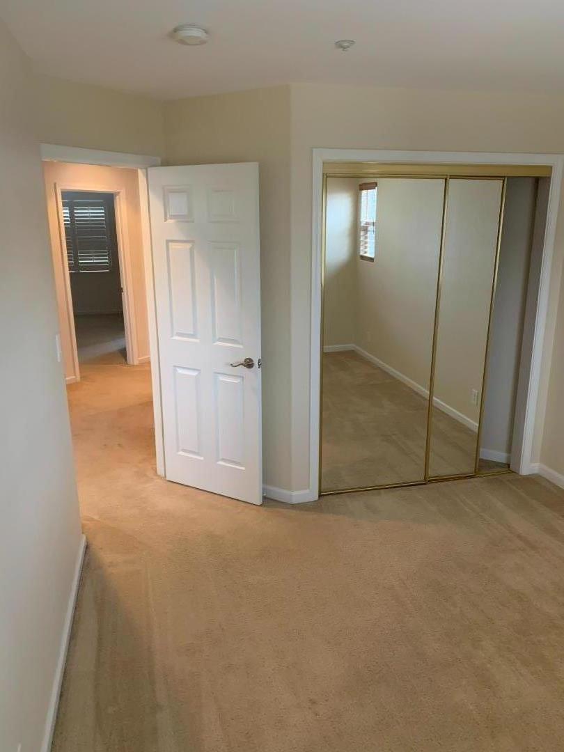 1007 Fitzgerald Street Salinas, CA 93906 - Photo 13 of 22 an empty room with closet and mirror