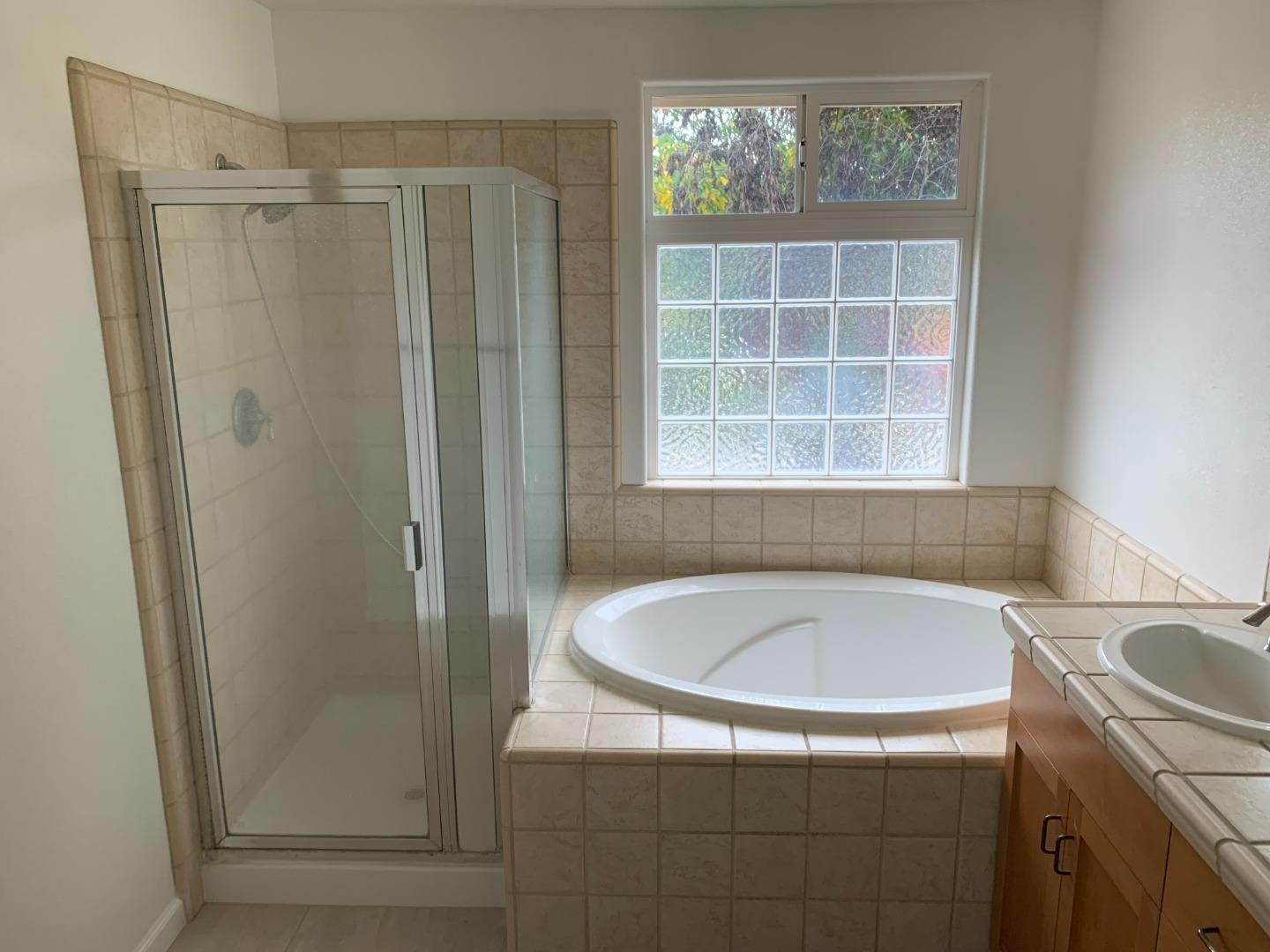 1007 Fitzgerald Street Salinas, CA 93906 - Photo 15 of 22 a bathroom with a sink and a shower