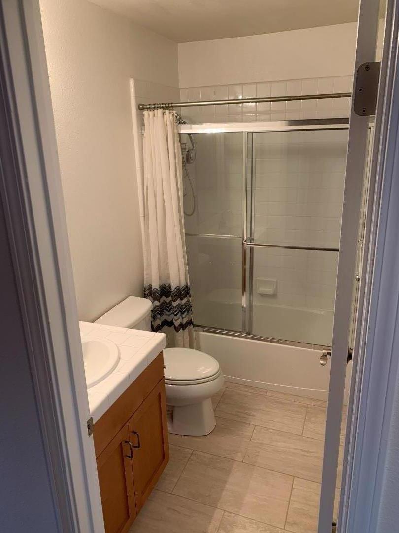 1007 Fitzgerald Street Salinas, CA 93906 - Photo 18 of 22 a bathroom with a sink toilet and shower