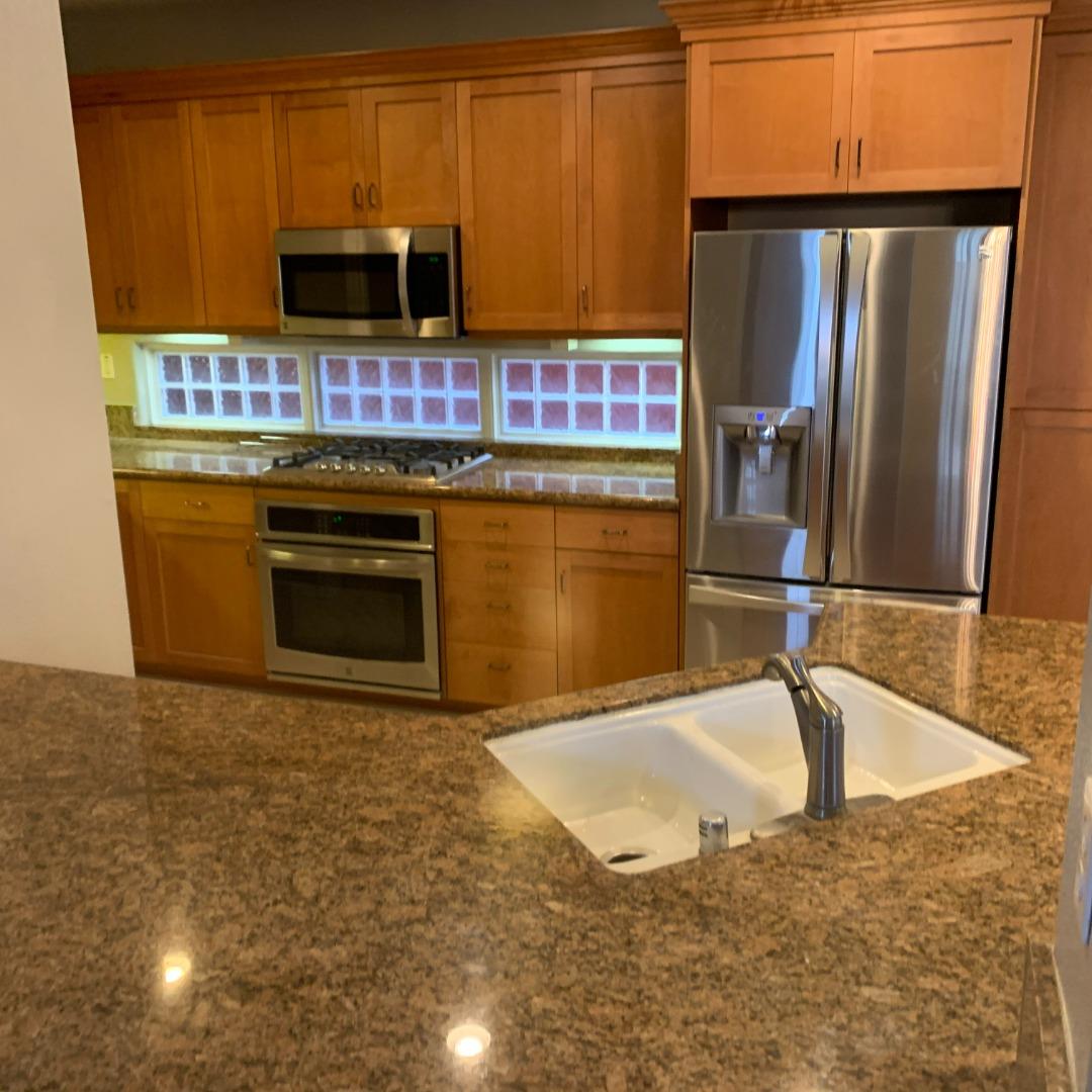 1007 Fitzgerald Street Salinas, CA 93906 - Photo 5 of 22 a kitchen with a refrigerator stove and microwave