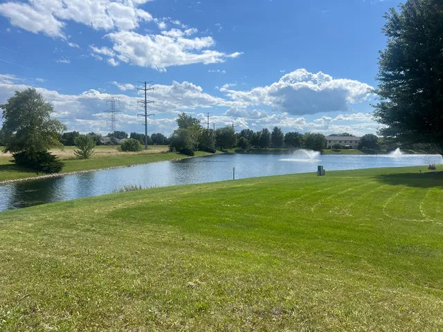 a view of a lake with houses in the back