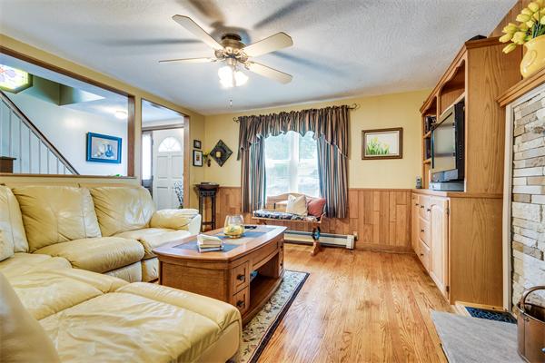 4 Old Providence Road Sutton, MA 01590 - Photo 11 of 30 a living room with fireplace furniture and a wooden floor