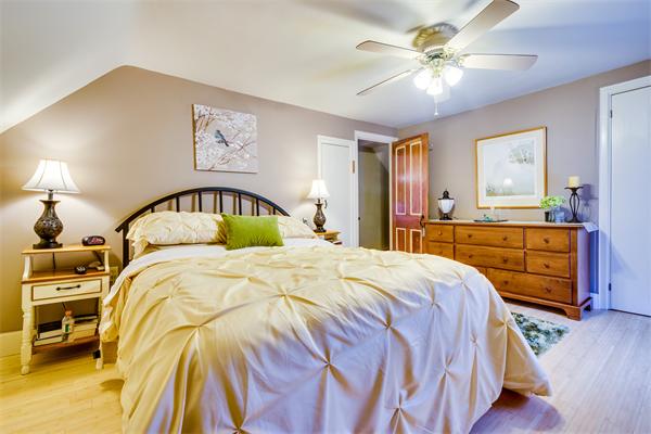 4 Old Providence Road Sutton, MA 01590 - Photo 16 of 30 a bedroom with a bed and a chandelier