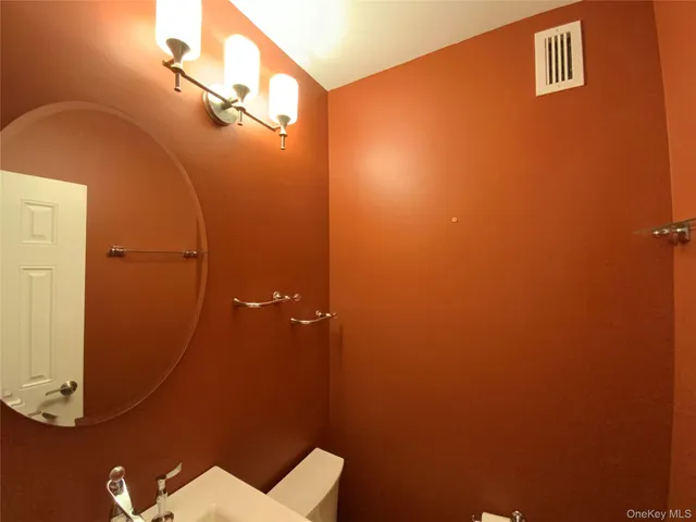 a bathroom with a sink and mirror