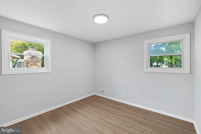 a bathroom with a double vanity sink a mirror and shower
