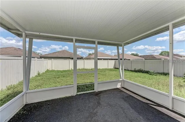 a view of backyard with green space
