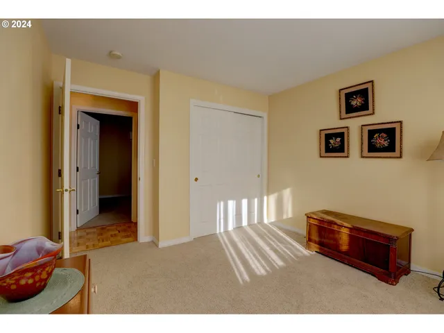 a bedroom with furniture and window