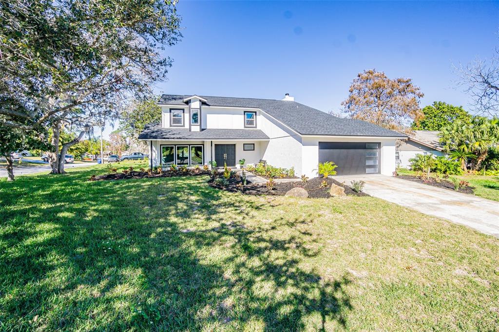 a front view of a house with a yard