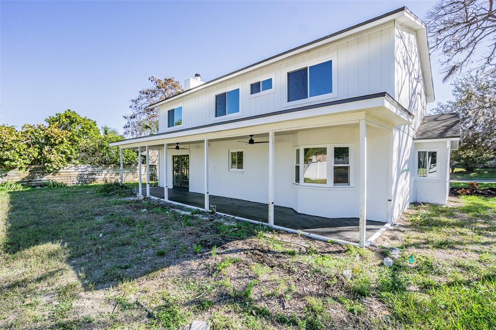 6370 Conniewood Square New Port Richey, FL 34653 - Photo 19 of 27 a front view of a house with a yard