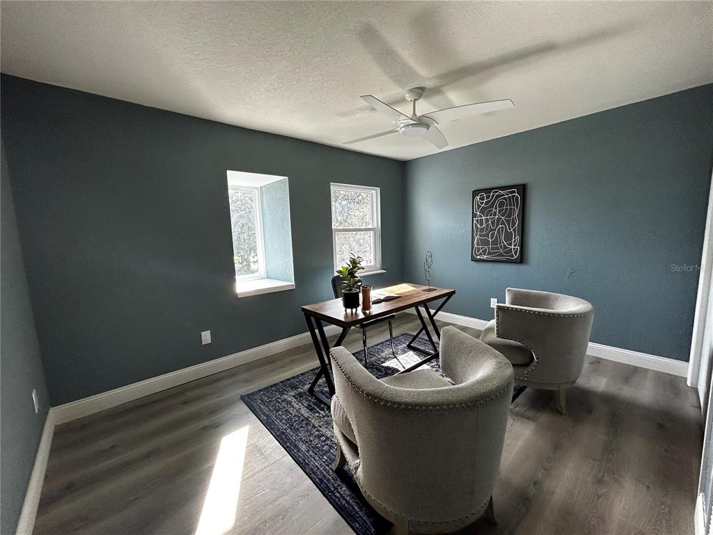 6370 Conniewood Square New Port Richey, FL 34653 - Photo 23 of 27 a living room with furniture and a wooden floor