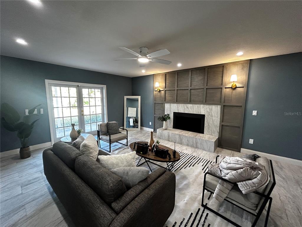6370 Conniewood Square New Port Richey, FL 34653 - Photo 27 of 27 a living room with furniture and a flat screen tv