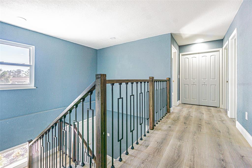 6370 Conniewood Square New Port Richey, FL 34653 - Photo 9 of 27 a view of a hallway with wooden floor and entryway